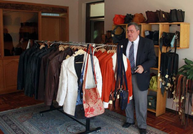 64 year old Ethiopian-Armenian leather businessman Vartkes Nalbandian look at the items in his shop in Addis Ababa, Ethiopia. Vartkes is among a small handful of people keeping the Armenian community in Ethiopia alive.  Photo: Elias Asmare, AP