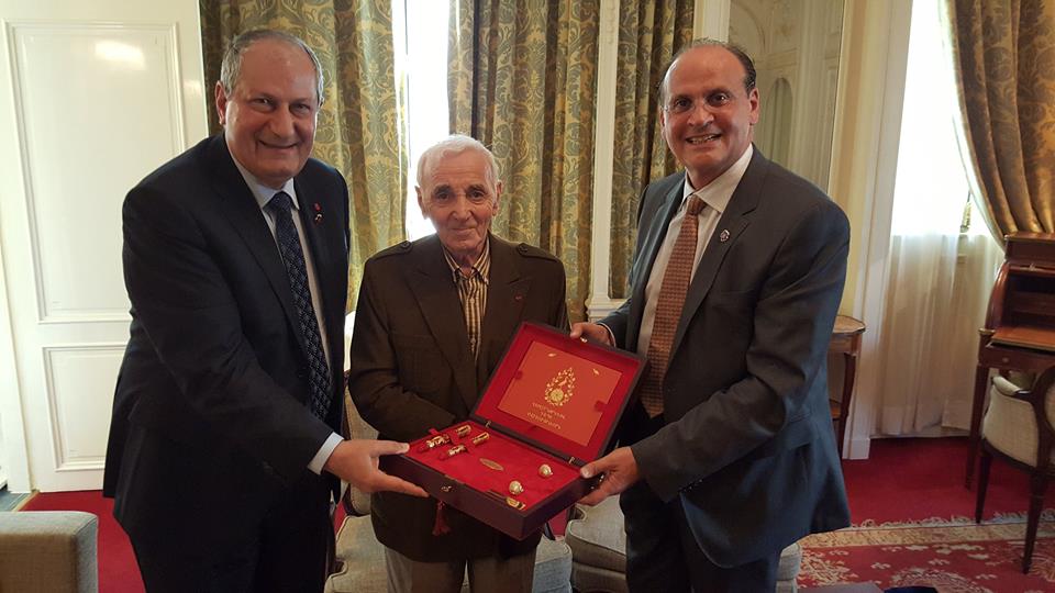 M.Sc. Krikor K. Jabourian and Dikran A. Tchablakian present to Charles Aznavour the Erebouni pen and the Rebirth Towards Eternity memorial book
